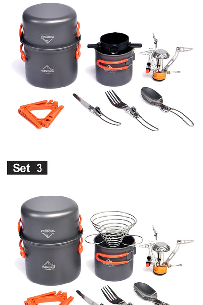 Collection of camping cookware and utensils including pots, pans, and cutlery on a white background.