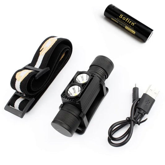 Black headlamp with strap, battery, and charging cable on a white background