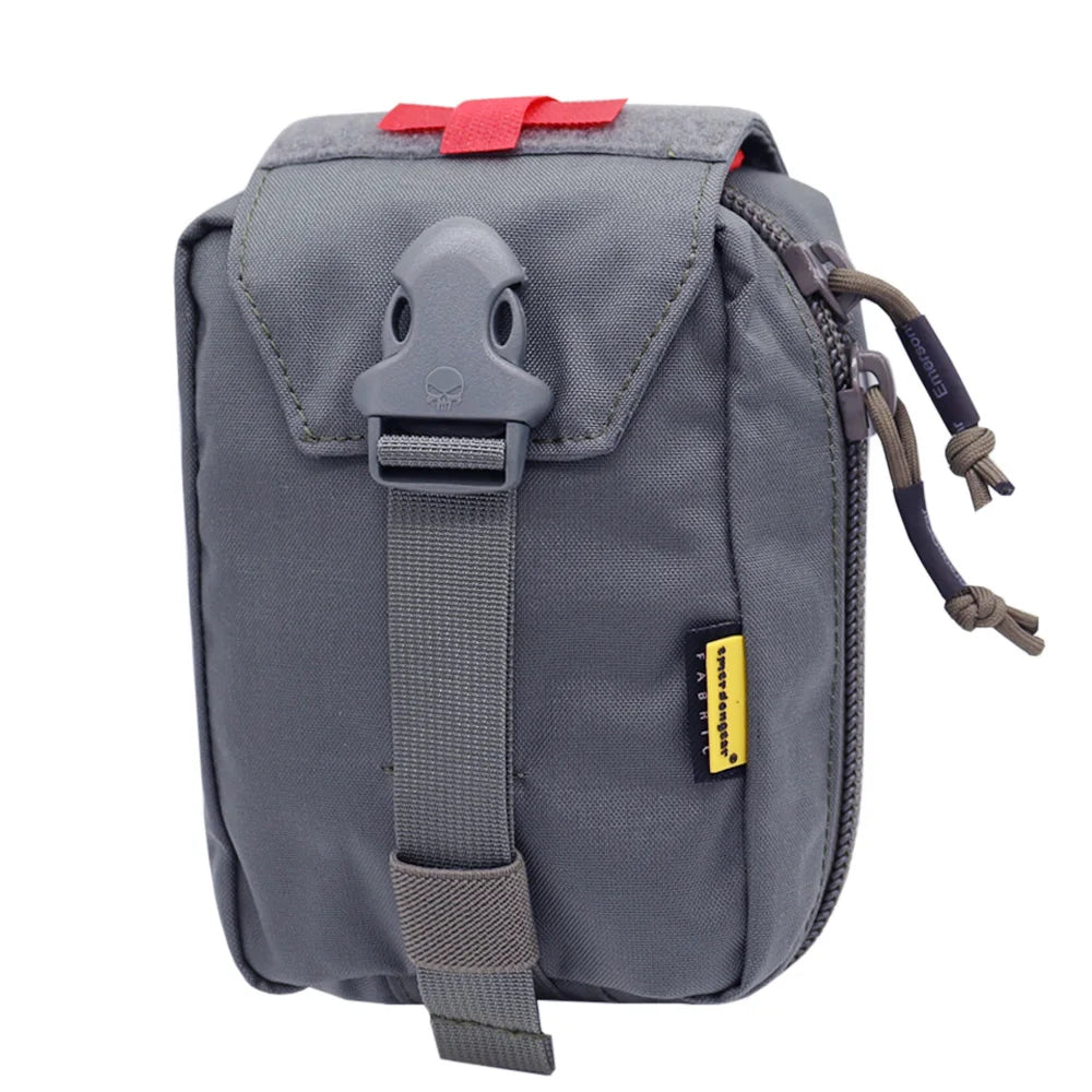 A gray tactical utility pouch with a front flap, gray plastic buckle, red top tab, and a small yellow-and-black brand tag, shown on a plain white background.