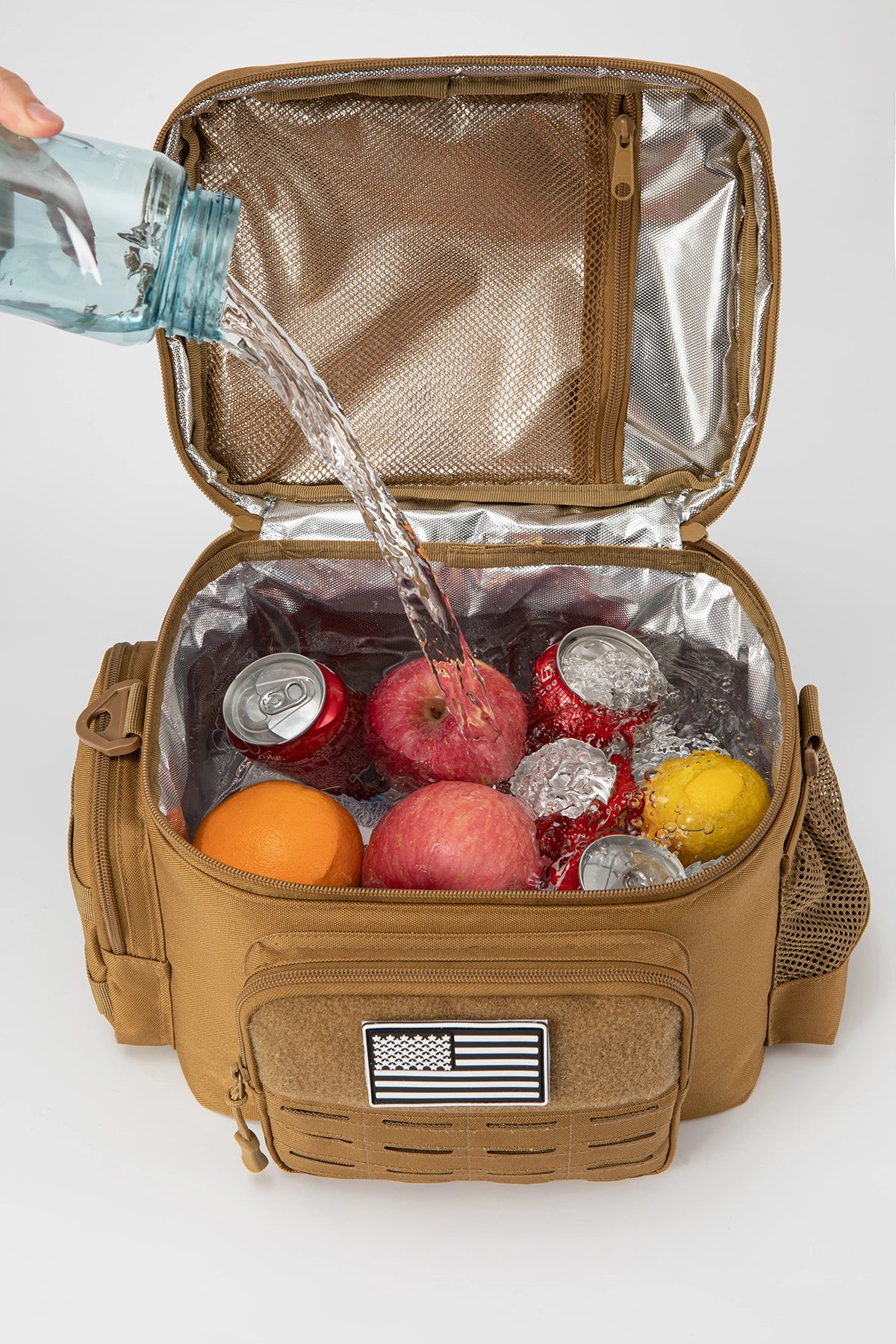 Brown insulated cooler bag with food items and a person pouring water into it on a white background
