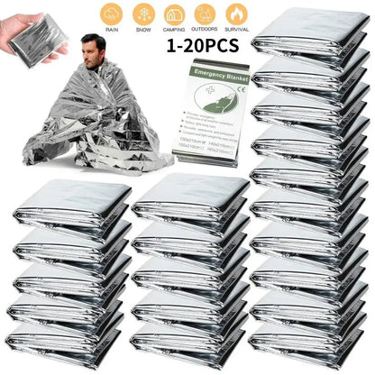 Multiple emergency blankets in packaging with a man demonstrating use, on a white background.