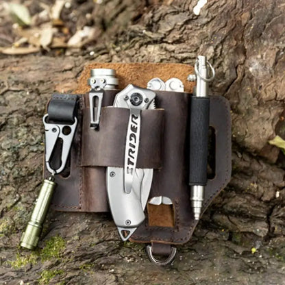 Multitool belt pouch with various tools on a wooden surface