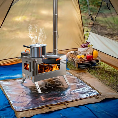 Camping stove with pots inside a tent, surrounded by cooking supplies on a ground mat.