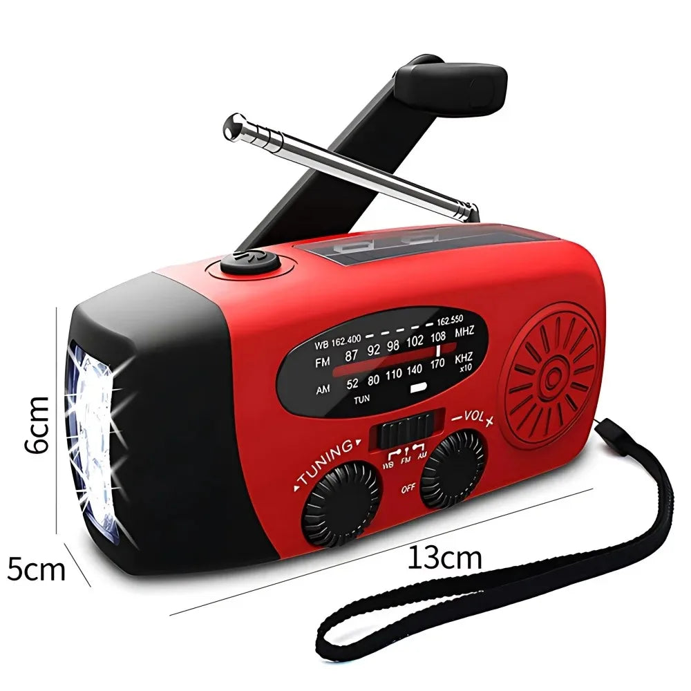Red and black portable emergency radio with a built-in flashlight, adjustable antenna, wrist strap, and dimension markings showing 6cm height, 5cm width, 13cm depth, and 10cm handle width on a white background.