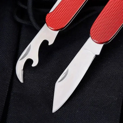 Multitool with red handle and silver tools on a black background