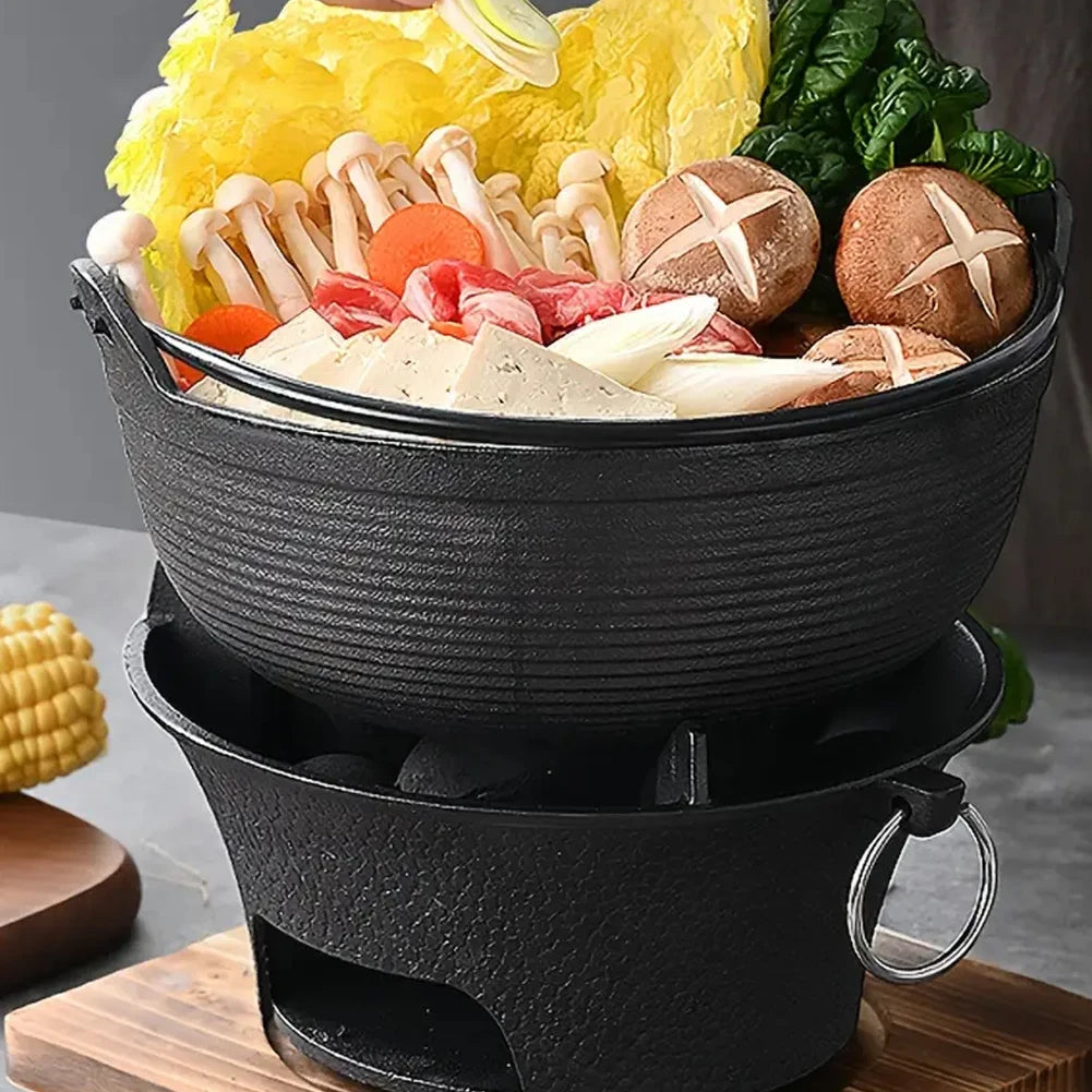 Hot pot with various ingredients on a wooden board