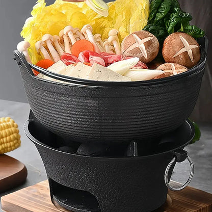 Hot pot with various ingredients on a wooden board