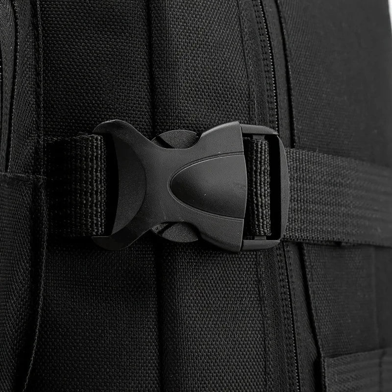 Close-up of a black backpack with a buckle on a dark background