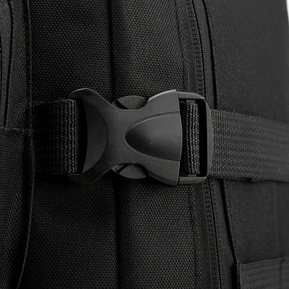 Close-up of a black backpack with a buckle on a dark background