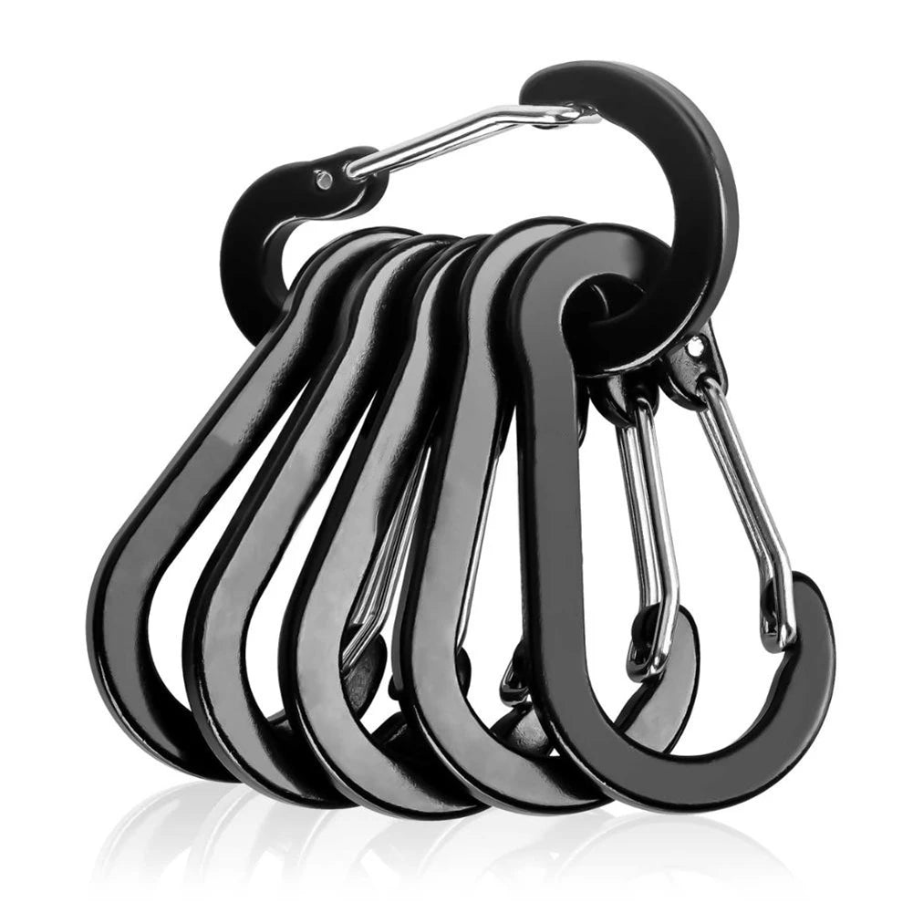 Set of black carabiners on a white background