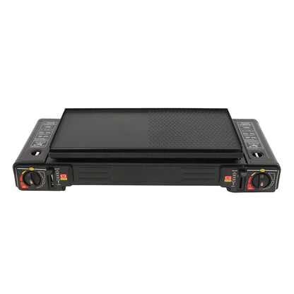 Black griddle with control knobs on a white background
