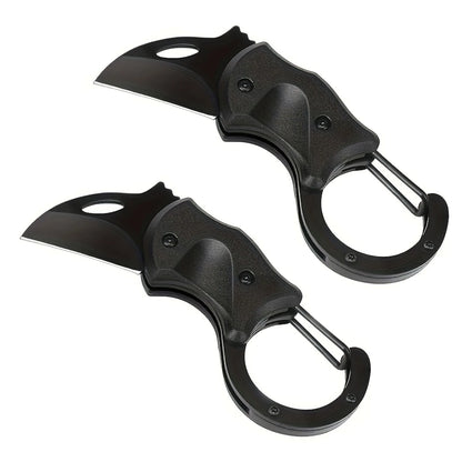 Two black folding knives on a white background