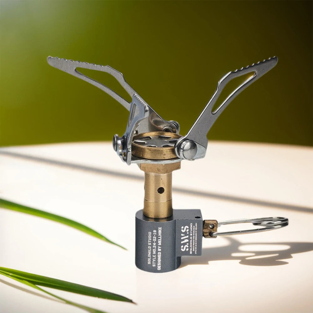 Portable camping stove with a green leaf background