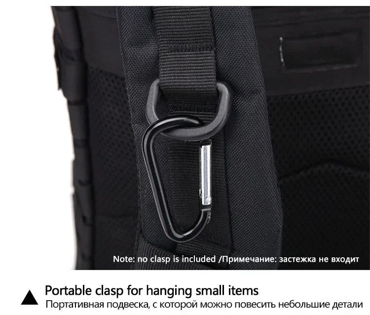 Black backpack with a portable clasp for hanging small items on a white background
