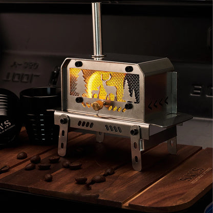 Portable stove with a decorative front panel on a wooden surface