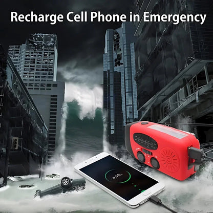 A red emergency power bank shown plugged into a smartphone displaying low battery, set against a dark, apocalyptic city scene with a large wave crashing. White text at the top reads 'Recharge Cell Phone in Emergency'.