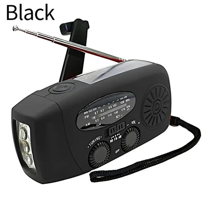 Black portable radio with antenna and flashlight on a white background