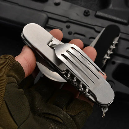 Multitool held in a hand with a dark background