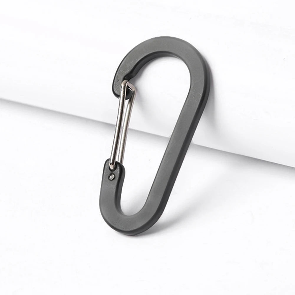 Black carabiner on a white background