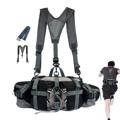 A black and gray running backpack with an integrated shoulder harness and waist belt system, shown on a white background with a small inset of a runner wearing the harness in use.