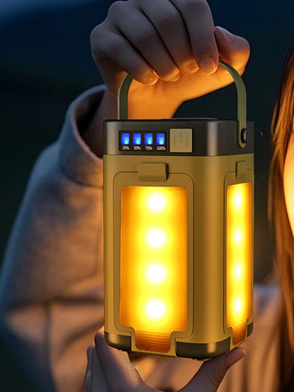 Person holding a portable lantern with glowing interior