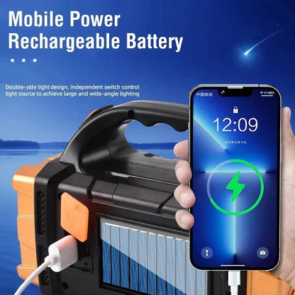 Portable power station with solar panel and phone charging, against a blue sky background