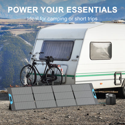 Solar panel in front of a caravan with a bicycle attached, set against a scenic background.