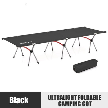 Black ultralight foldable camping cot with carrying bag on a white background