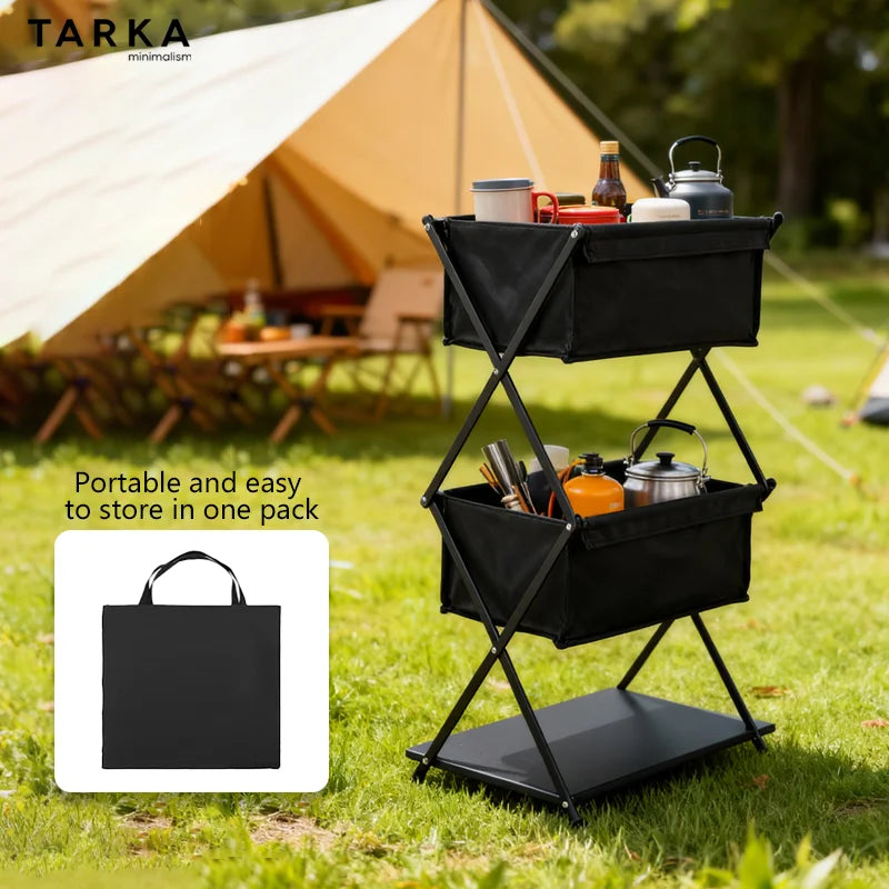 Portable camping cart with supplies in a grassy area with a tent in the background, featuring Tarka branding.