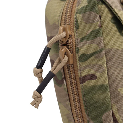 Close-up of a camouflage pouch with a tan zipper, tan plastic teeth, and beige drawcord pulls with black handles on a white background.