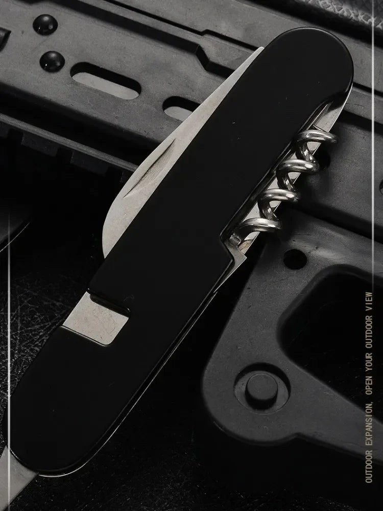 Multitool with knife blade and screwdriver on a dark background