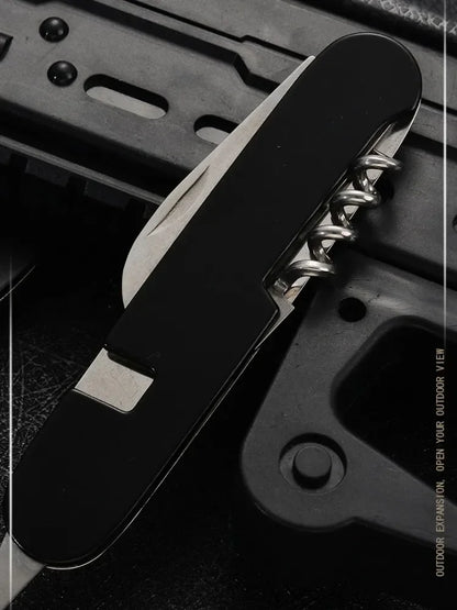 Multitool with knife blade and screwdriver on a dark background