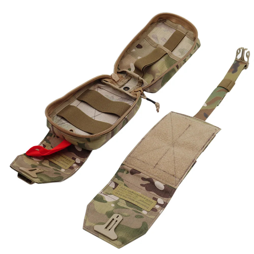 A tactical utility pouch in a multi-terrain camouflage pattern, shown open with its red zipper pull and a separate matching strap laid out on a white background.