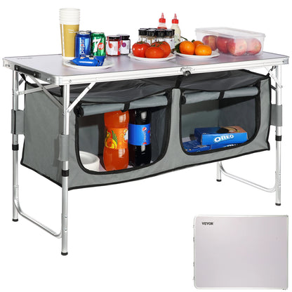 Portable folding table with storage compartments and food items on a white background