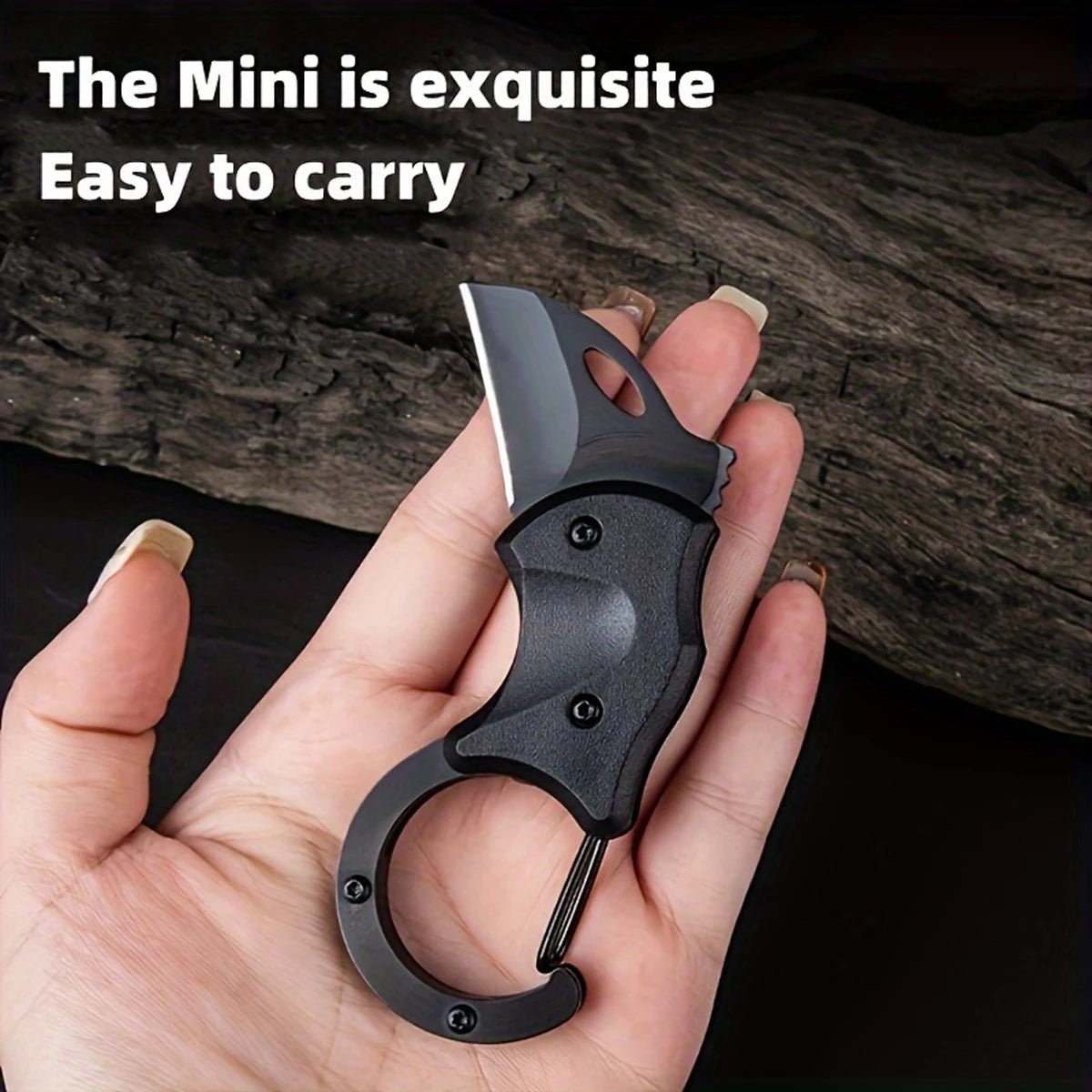 Black mini knife held in a hand with text 'The Mini is exquisite Easy to carry' against a dark background.