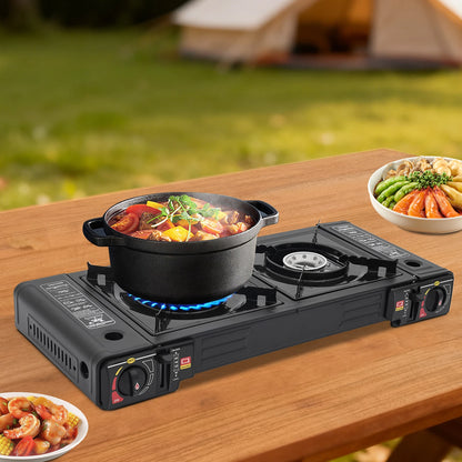 Portable camping stove with a pot of food on a wooden table outdoors.