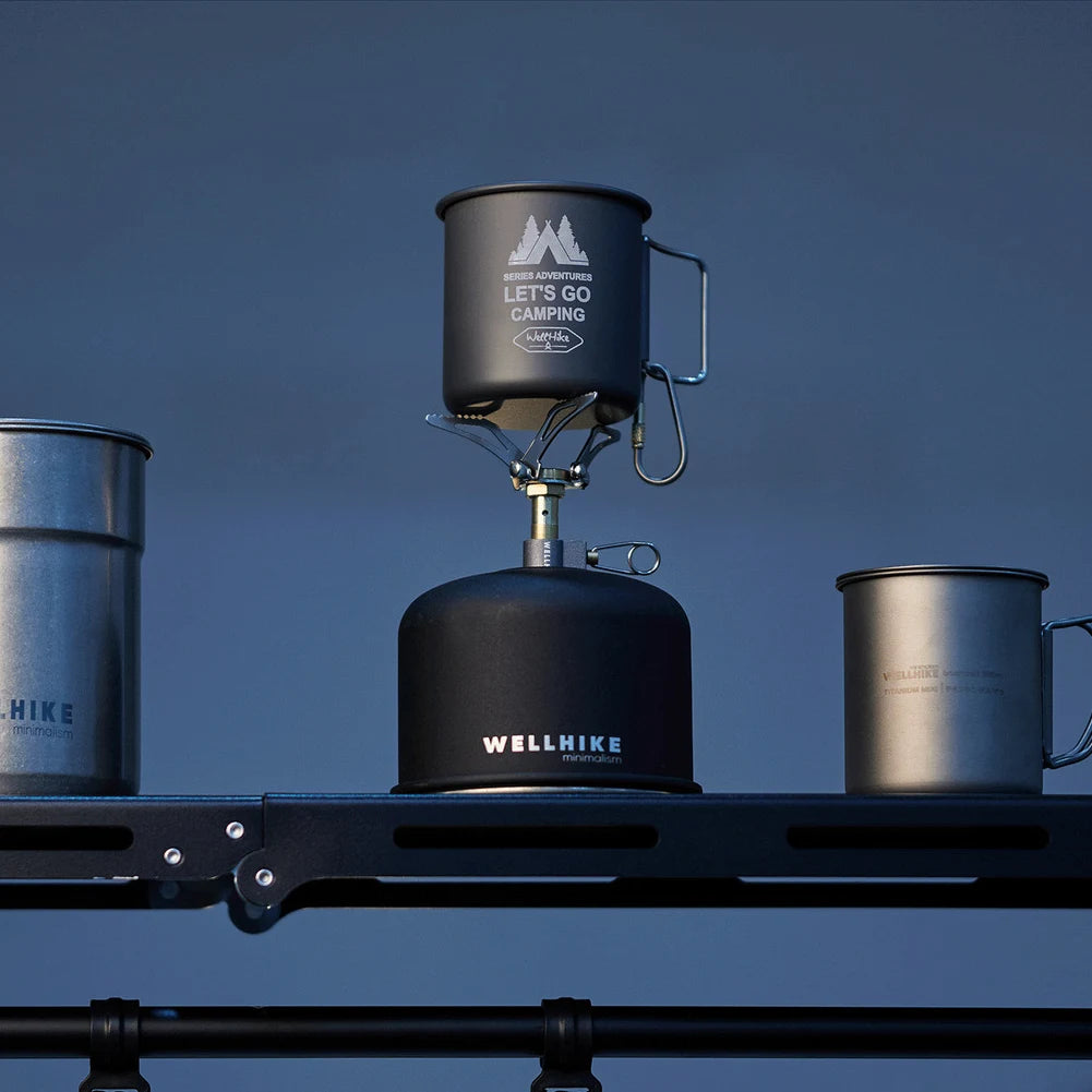 Camping stove with pots on a blue background
