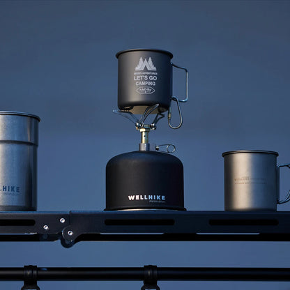 Camping stove with pots on a blue background