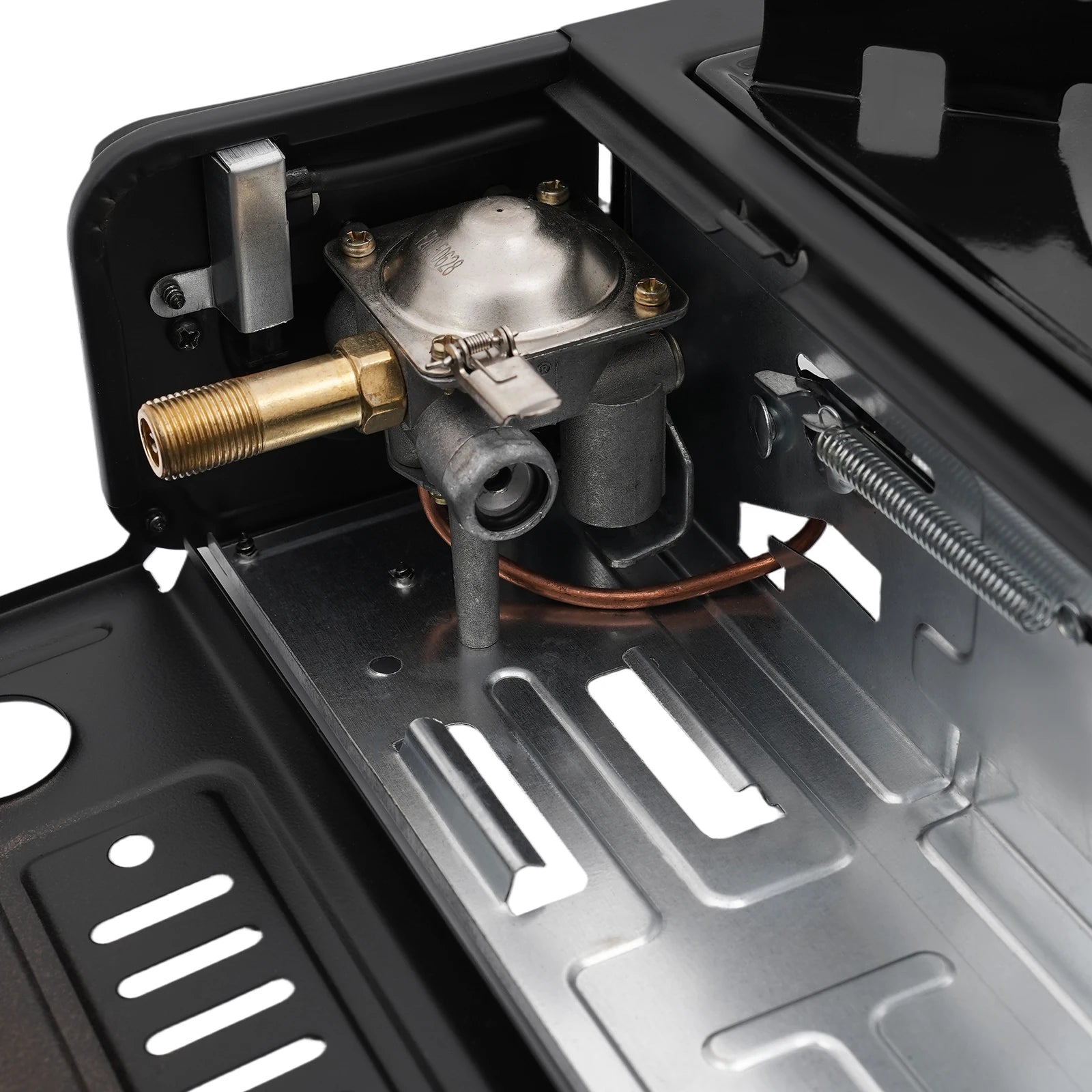 Close-up of a mechanical component inside a camp stove with a metallic finish.