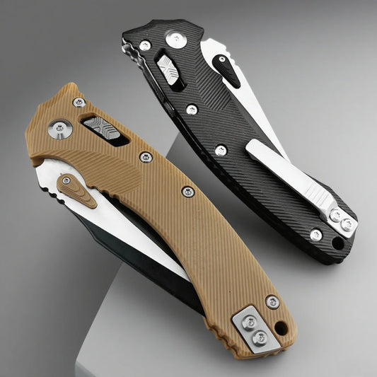 Two folding knives, one brown and one black, on a gray background