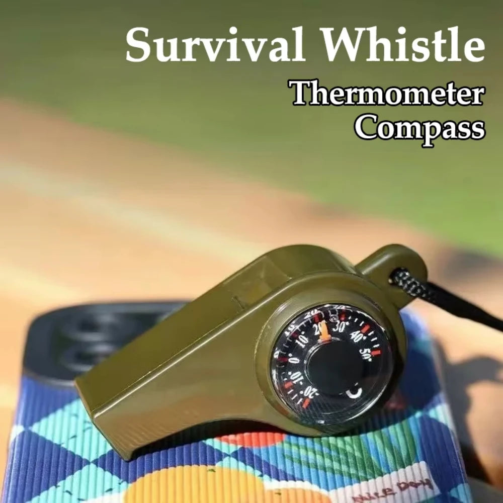 Survival whistle with thermometer and compass functions on a colorful mat.