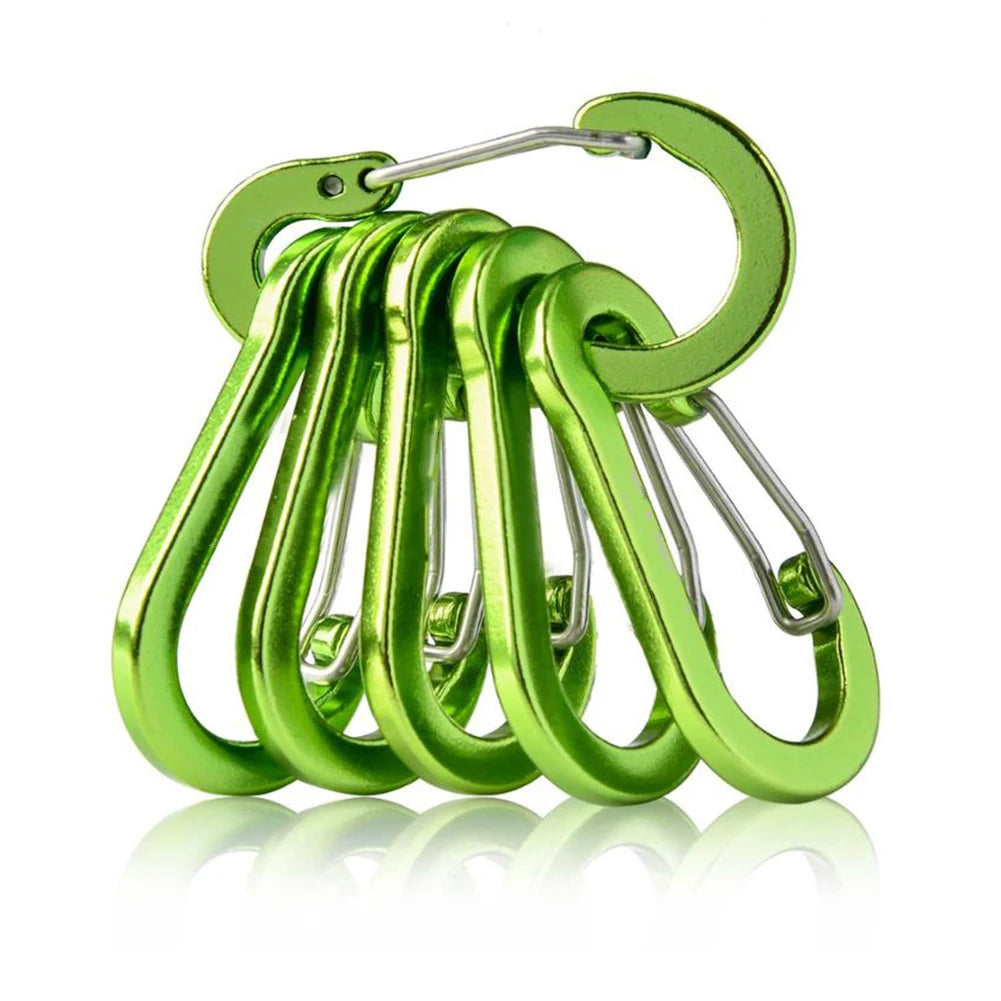 Set of green carabiners on a white background
