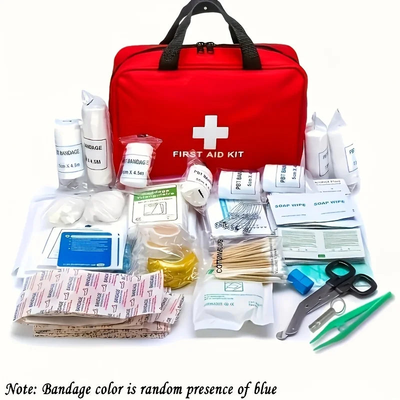 A red first aid kit bag with a white cross and 'FIRST AID KIT' printed on the front, displayed with assorted medical supplies arranged in front on a white background. The kit includes bandages, gauze, antiseptic wipes, tweezers, scissors, and other first aid items.