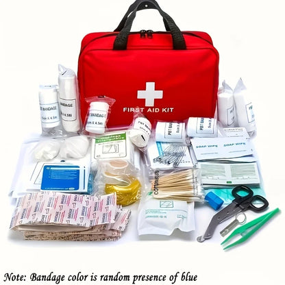 A red first aid kit bag with a white cross and 'FIRST AID KIT' printed on the front, displayed with assorted medical supplies arranged in front on a white background. The kit includes bandages, gauze, antiseptic wipes, tweezers, scissors, and other first aid items.