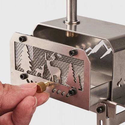 Metal wood stove with an engraved design on a white background