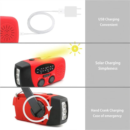 Red and black portable radio with solar panel, USB cable, and hand crank on a white background.