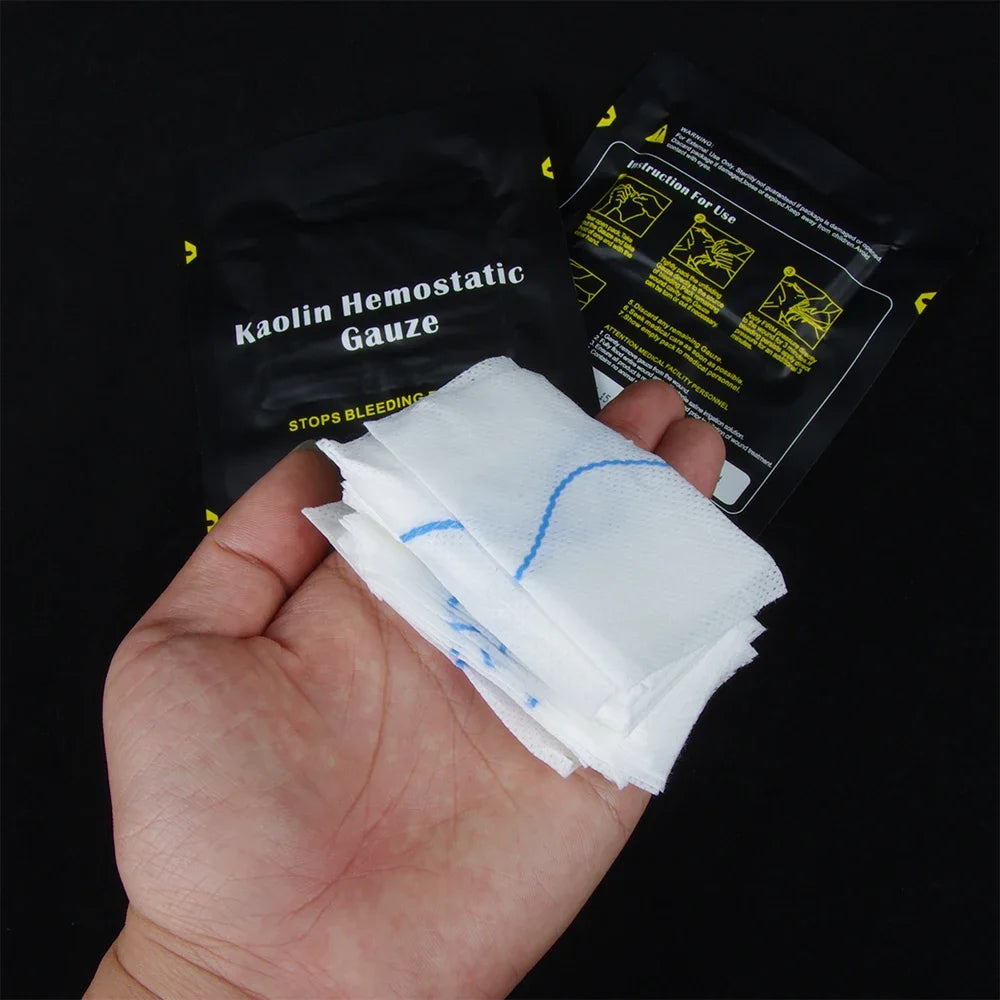 Hand holding Kaolin Hemostatic Gauze with packaging in the background