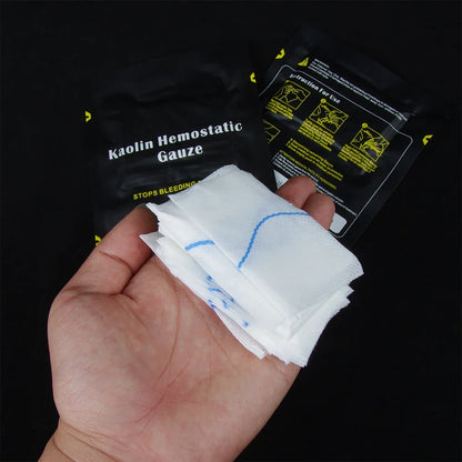 Hand holding Kaolin Hemostatic Gauze with packaging in the background