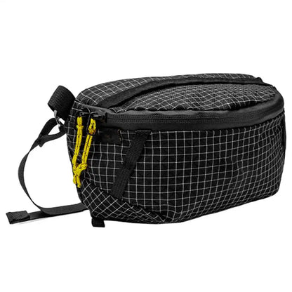 Black grid-patterned bag with a yellow zipper on a white background