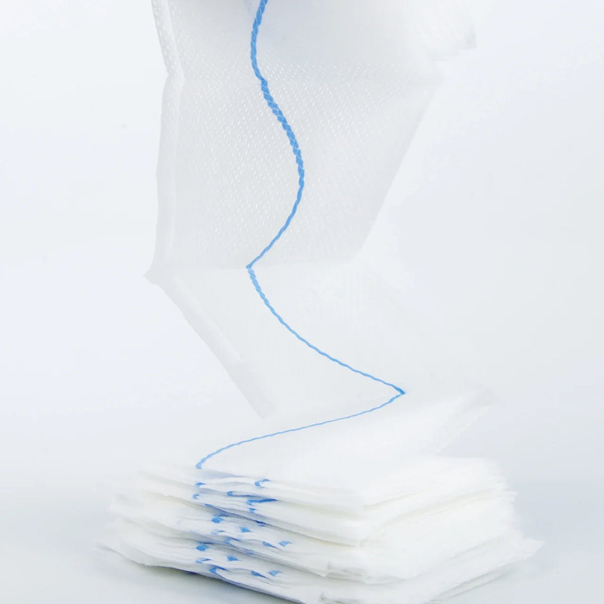 Stack of white paper cups with blue lines on a white background
